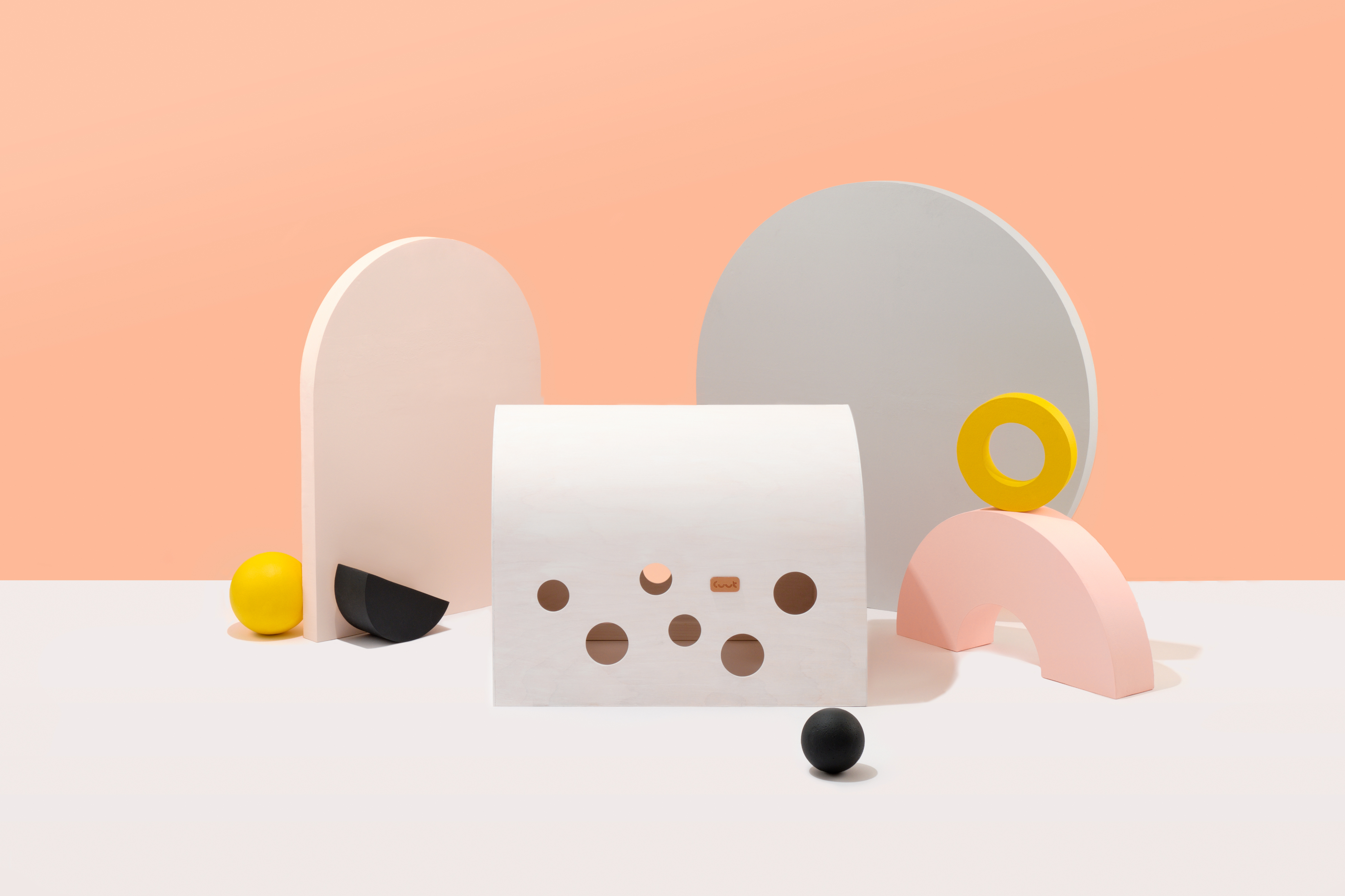 Cuut small pet crate in white with abstract modern shapes in the background