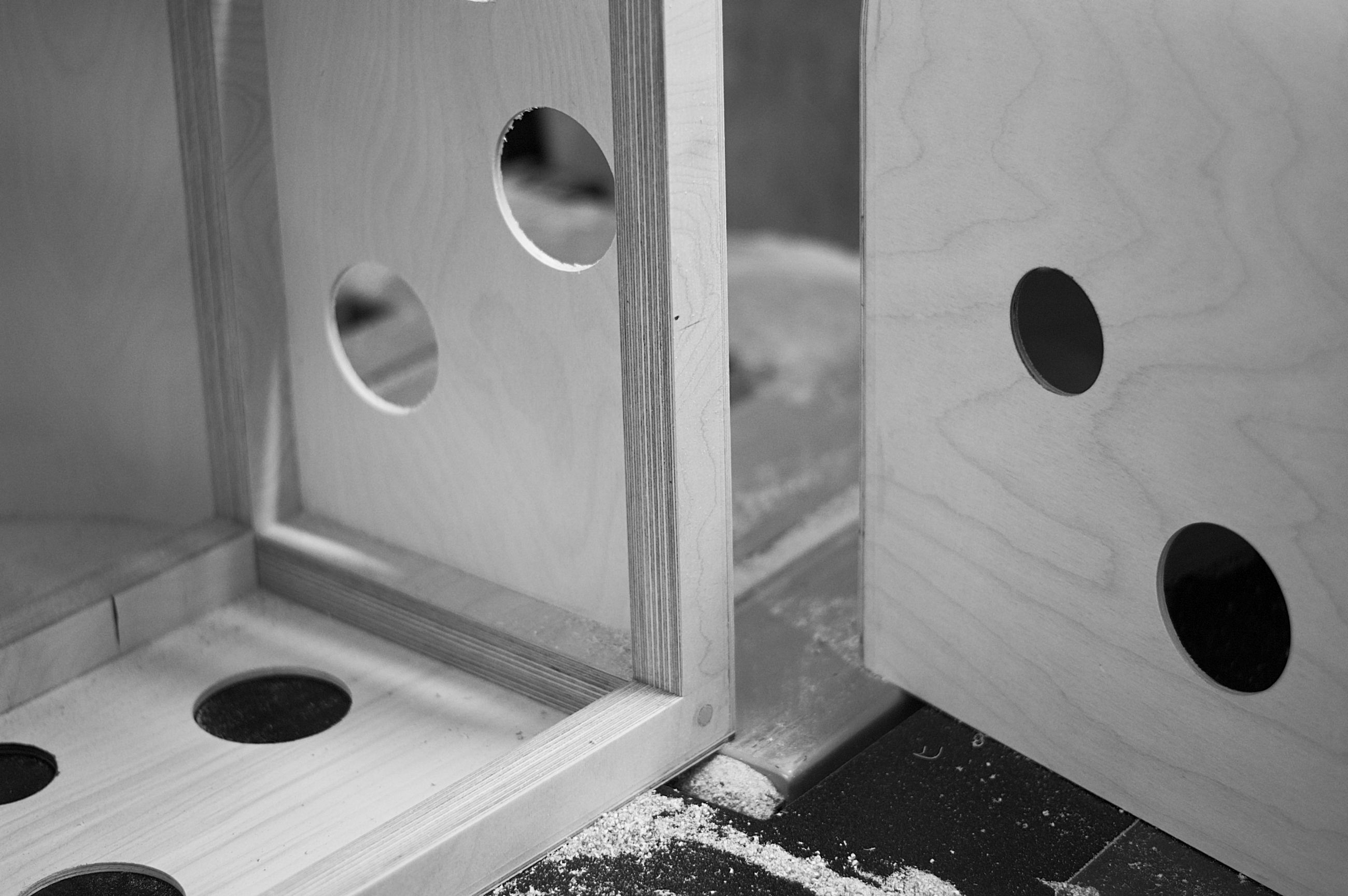 White Cuut pet crate with a small dog beside it in a minimalist interior scene